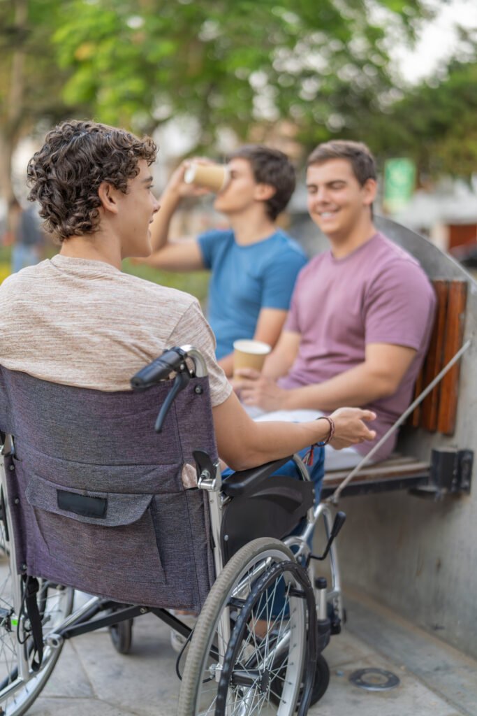 Friends socialising over coffee during outdoor NDIS Group & Centre-Based Activities with Improved Ability.